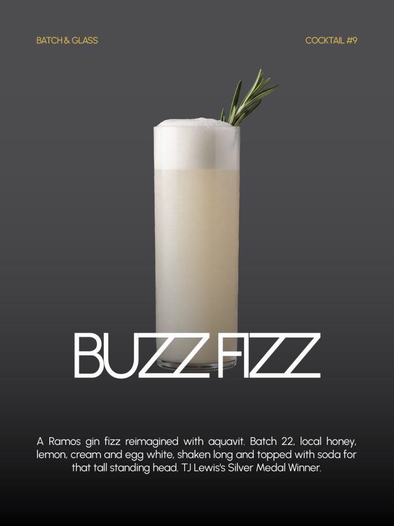 Buzz Fizz cocktail in a tall glass with a foam head and rosemary sprig, the 2nd place winner of the Batch 22 Cocktail Contest, created by TJ Lewis