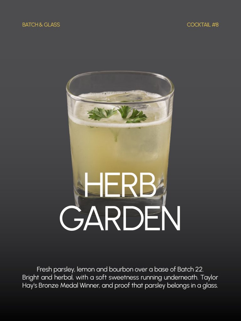 Herb Garden cocktail in a rocks glass garnished with parsley, the 3rd place winner of the Batch 22 Cocktail Contest, created by Taylor Hay
